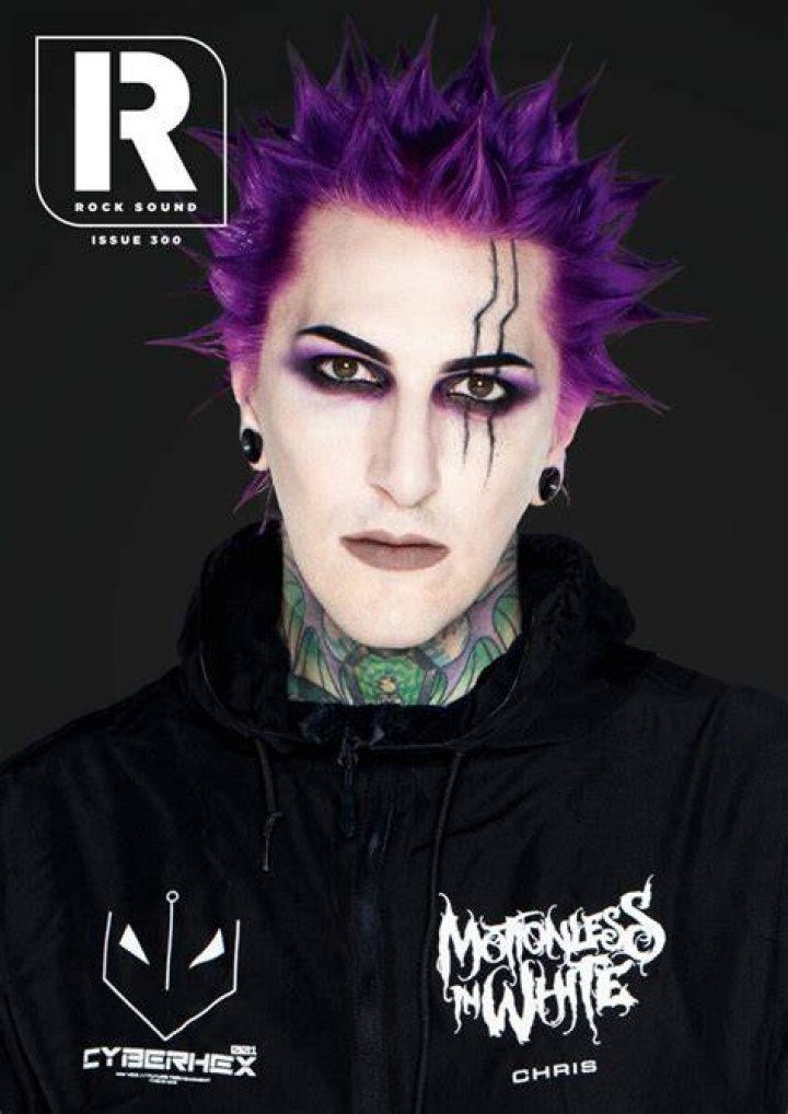 Chris motionless in a suit